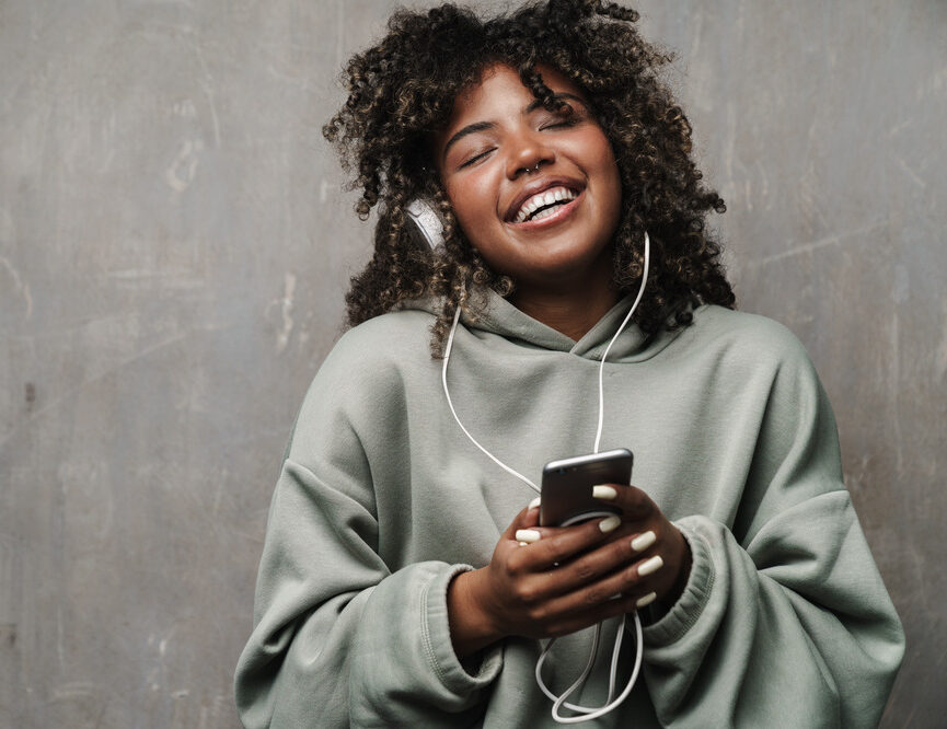 Happy young teen listening to music