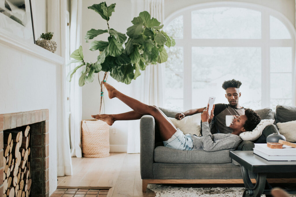 Couple reading a book on the couch