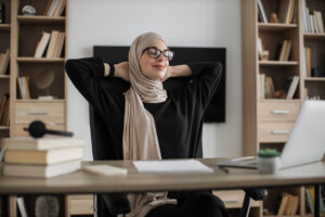 Muslim woman stretching and relaxing for stress management