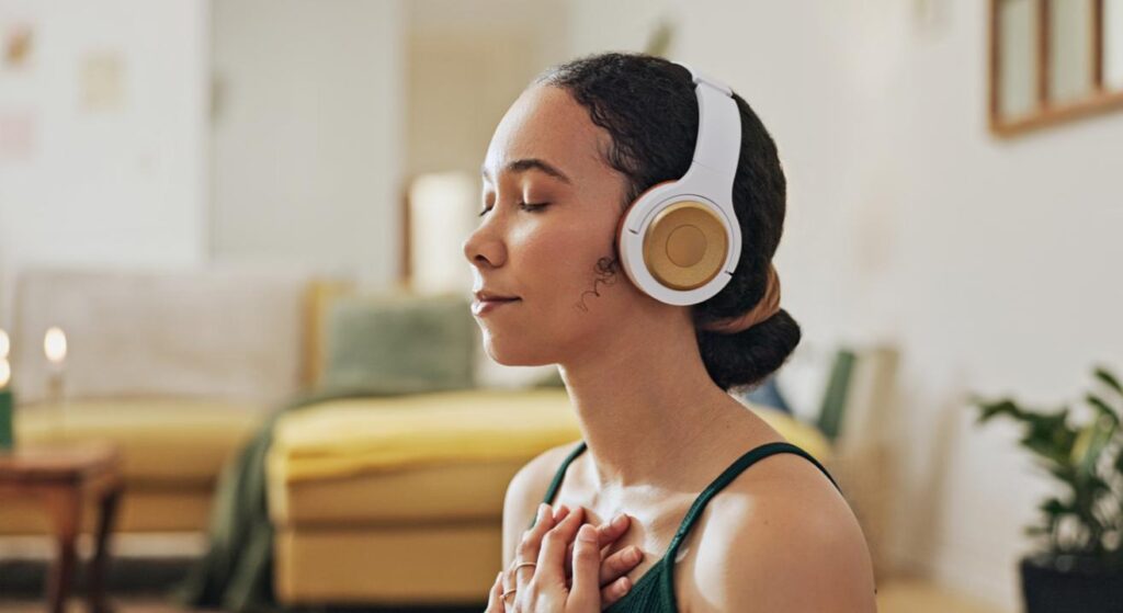 Woman, meditation and yoga in headphones listening to calm music