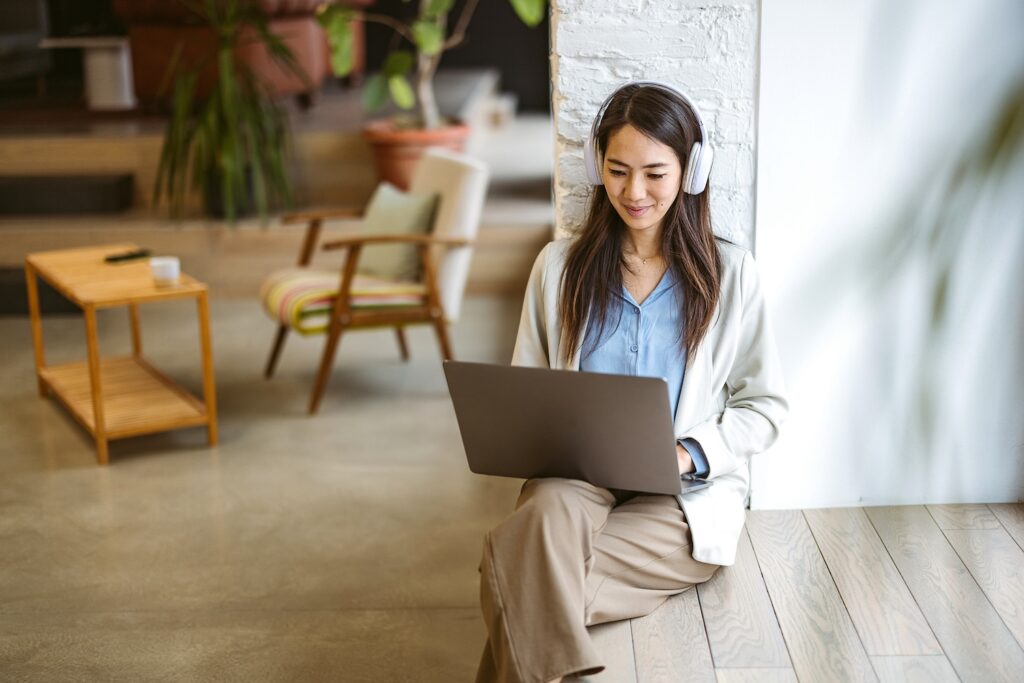 Woman sitting on a laptop in a counselling session