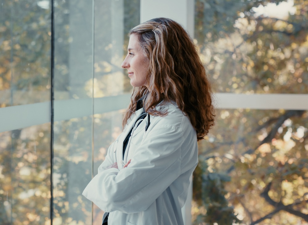 Relax, thinking and happy home mindset looking out a window at nature with a young woman. Calm, content and serene lifestyle of a female with an idea and feeling of hope and happiness in winter