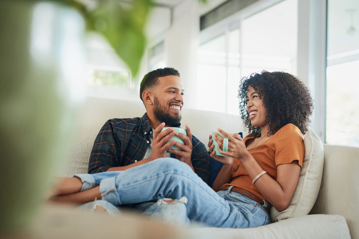 Shot of a young couple enjoying a coffee break while relaxing together at home